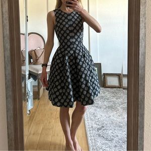 Black and gray dress with full skirt and raceback back with zipper